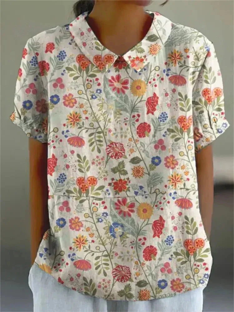 Damen Polo mit floralem Stickmuster und kurzen Ärmeln