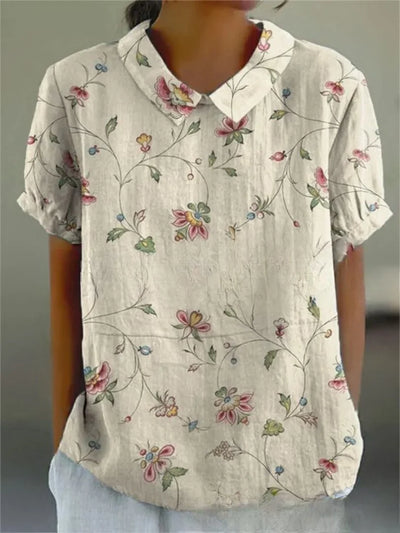 Damen Polo mit floralem Stickmuster und kurzen Ärmeln